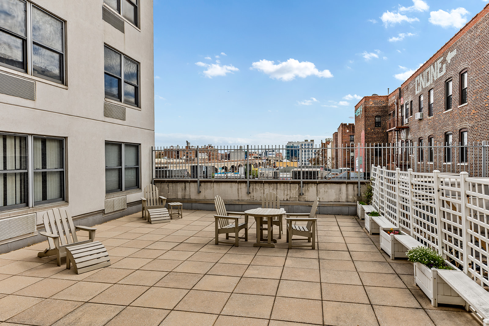 4102 Queens Boulevard, Unit 3D Queens, NY 11104 - Photo 6 of 7 a view of a terrace with chairs
