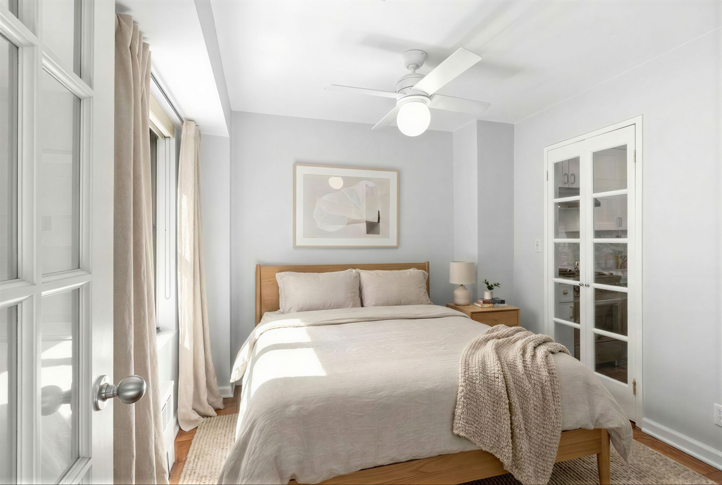 310 Lexington Avenue, Unit 9F Manhattan, NY 10016 - Photo 3 of 12 a bedroom with a bed and a window
