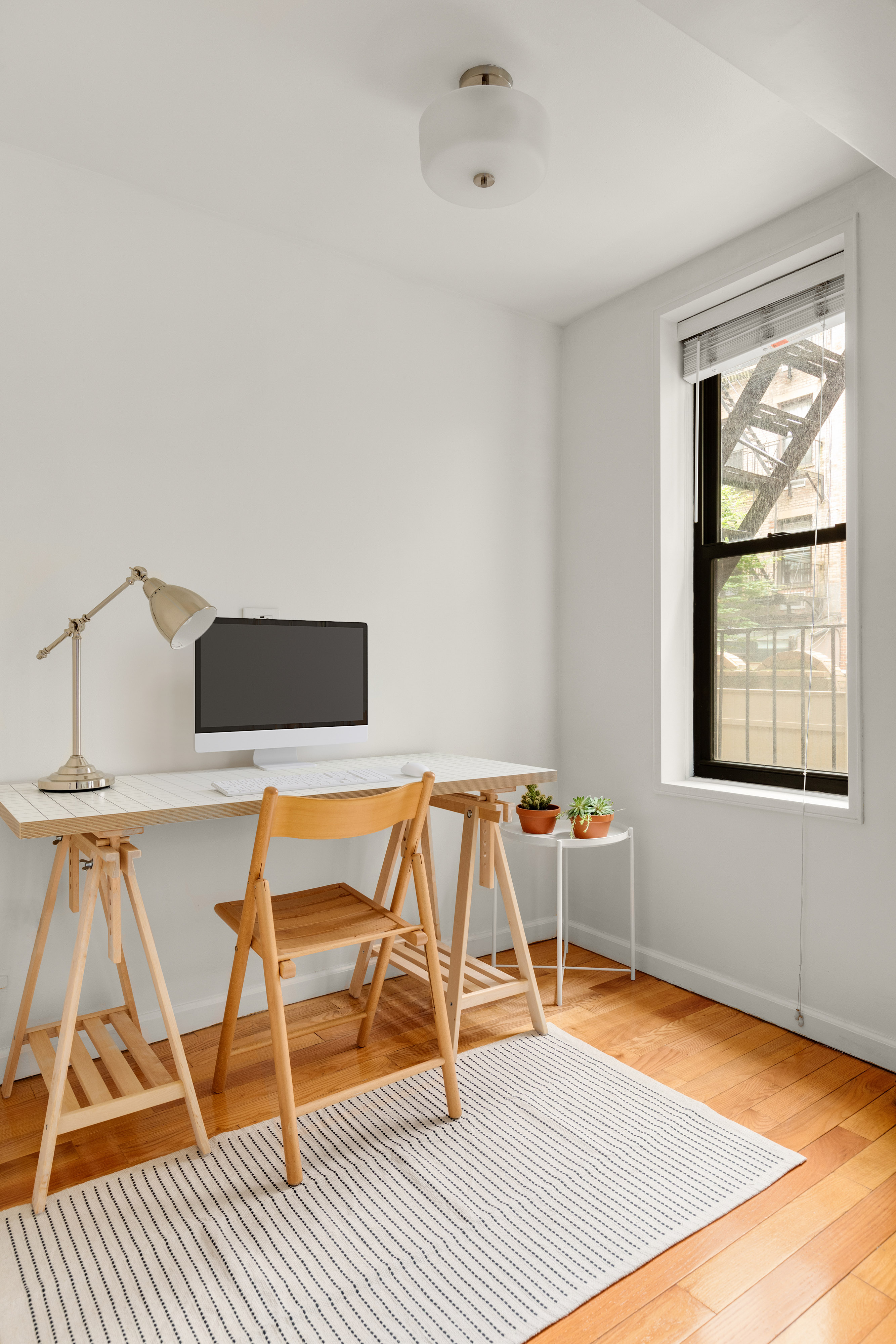 342 East 53rd Street, Unit 1G Manhattan, NY 10022 - Photo 7 of 9 a living room with a rug chairs and a table