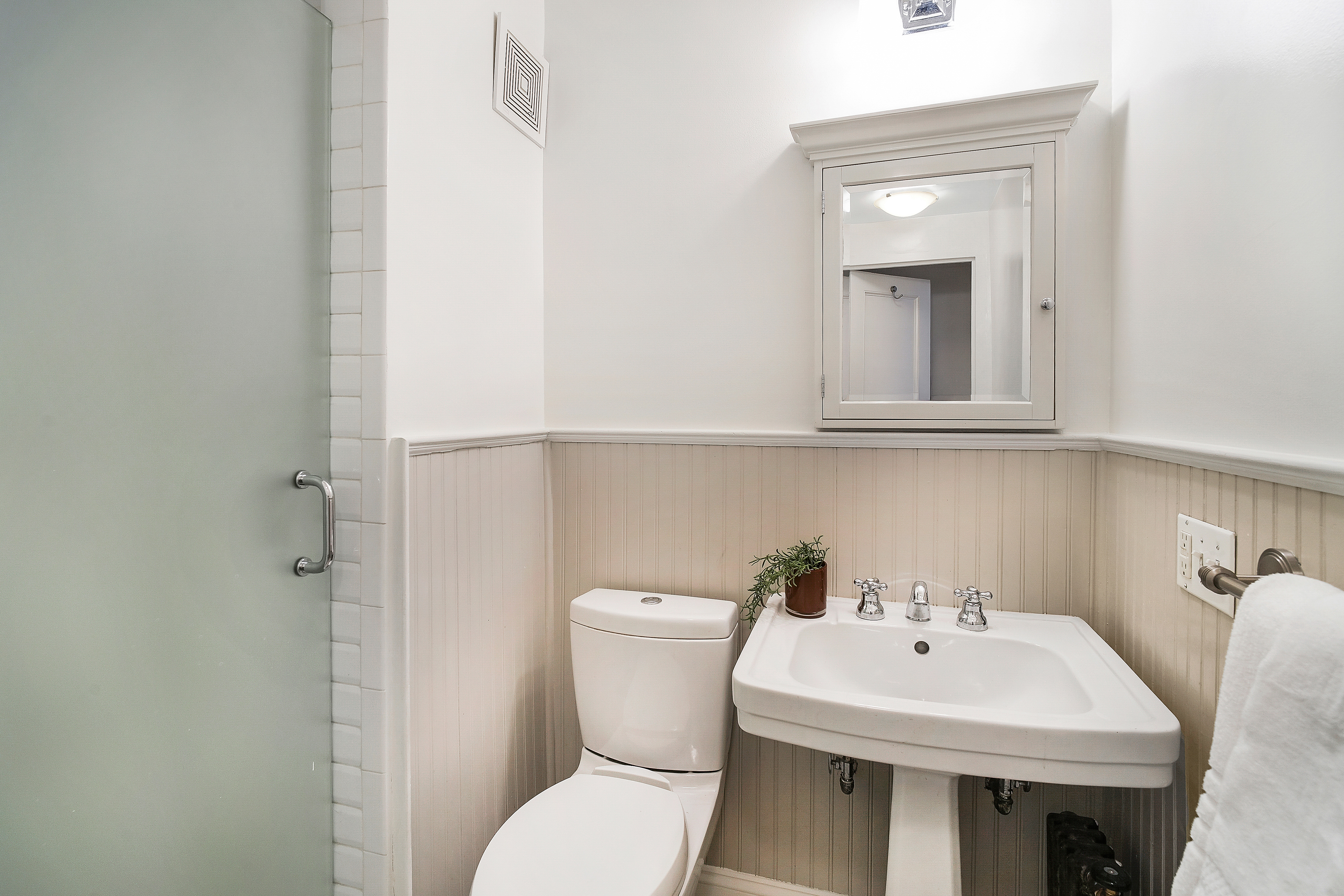 315 Riverside Drive, Unit 11B Manhattan, NY 10025 - Photo 13 of 19 a bathroom with a sink a toilet and a mirror