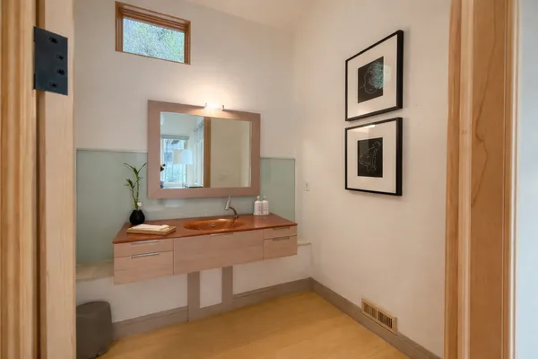 a bathroom with a sink and a mirror
