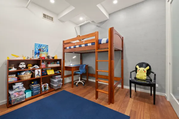 a room with lots of furniture and wooden floor