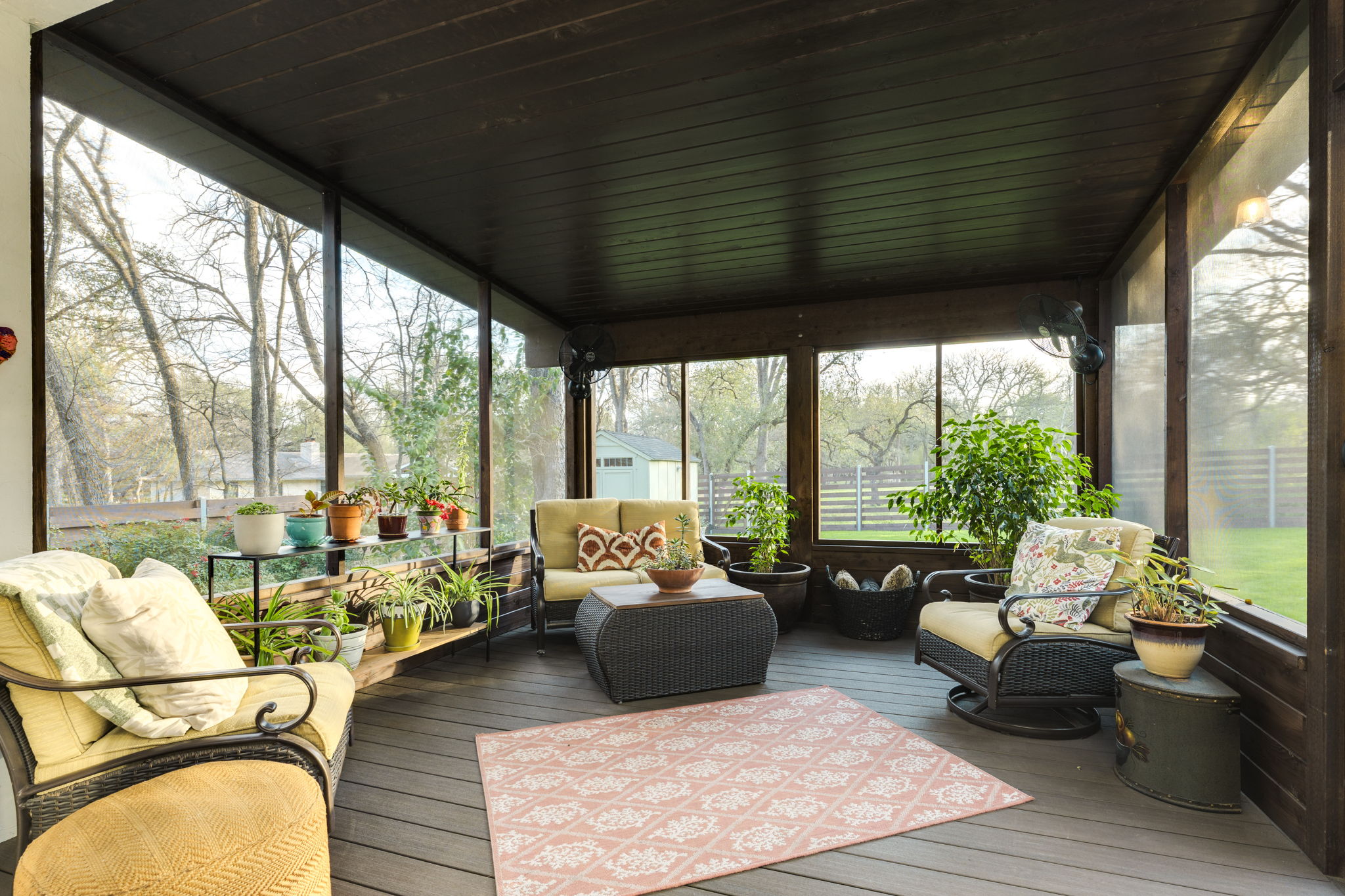 109 West Spring Drive Austin, TX 78746 - Photo 18 of 22 a living room with furniture large windows and wooden floor