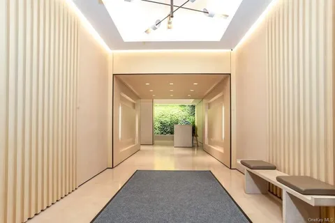 a view of a hallway with windows