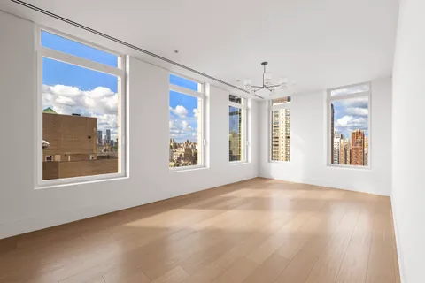 a view of an empty room with windows