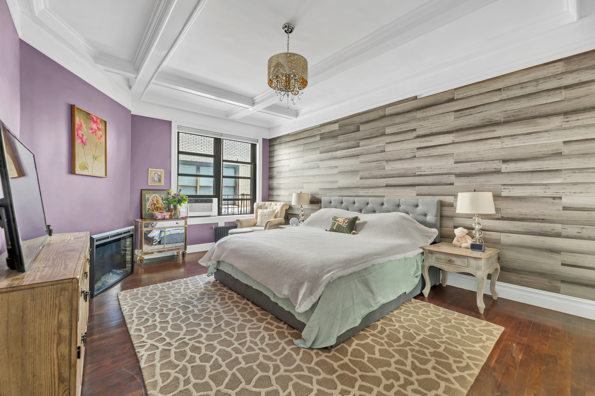 545 West 111th Street, Unit 10G Manhattan, NY 10025 - Photo 4 of 12 a bedroom with a large bed and a window