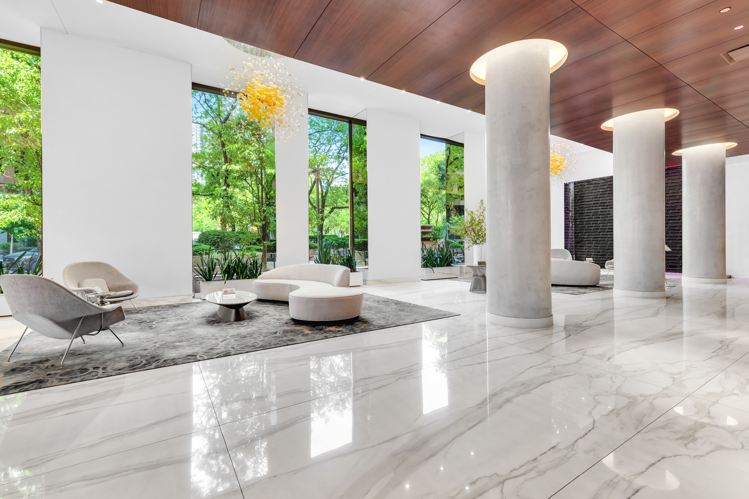 630 1st Avenue, Unit 16JK Manhattan, NY 10016 - Photo 11 of 13 a room with granite countertop a couch and a large window