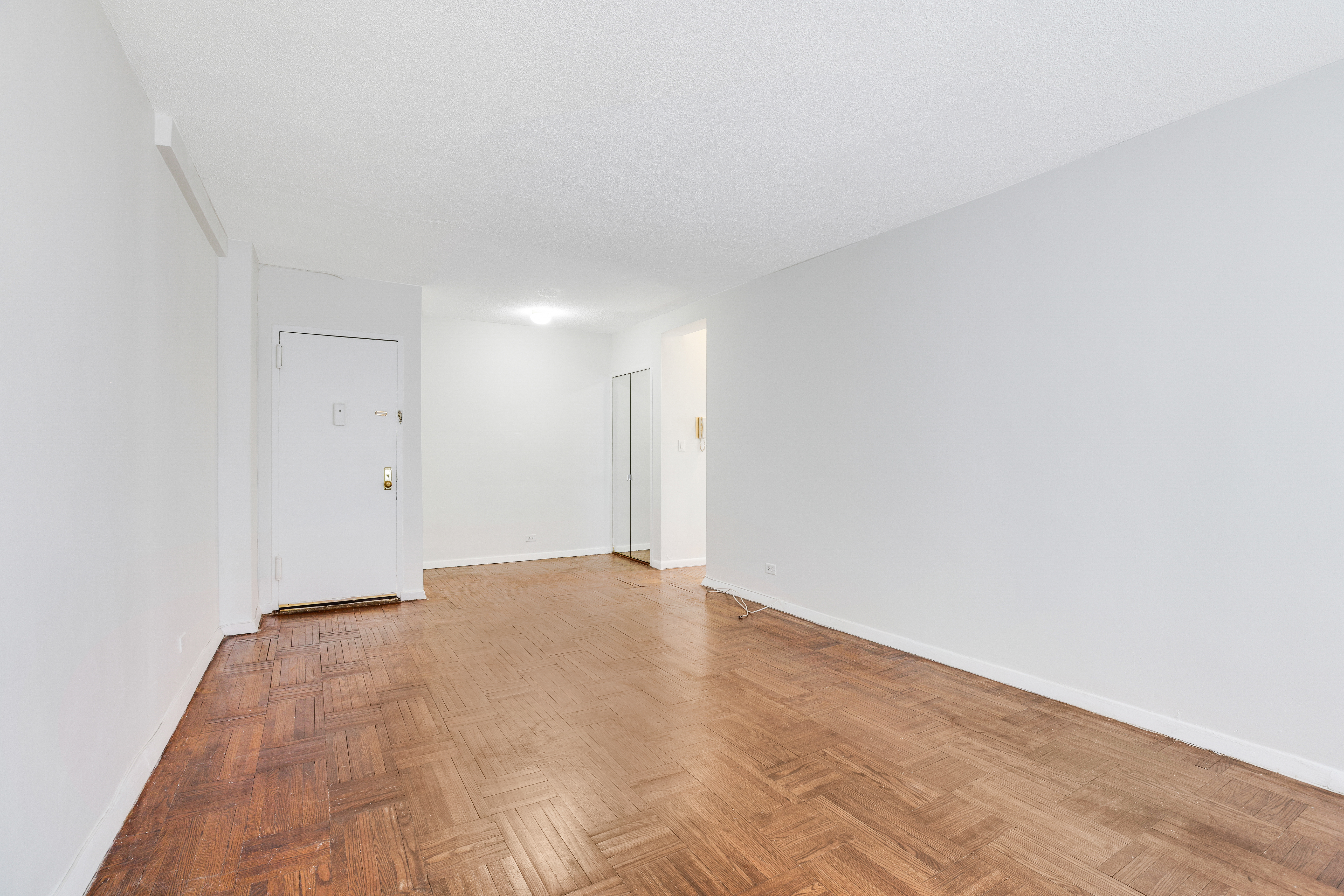 210 East 47th Street, Unit 7J Manhattan, NY 10017 - Photo 8 of 12 a view of an empty room