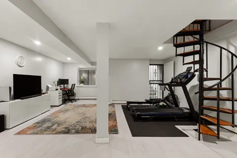 a living room with lots of furniture and a flat screen tv