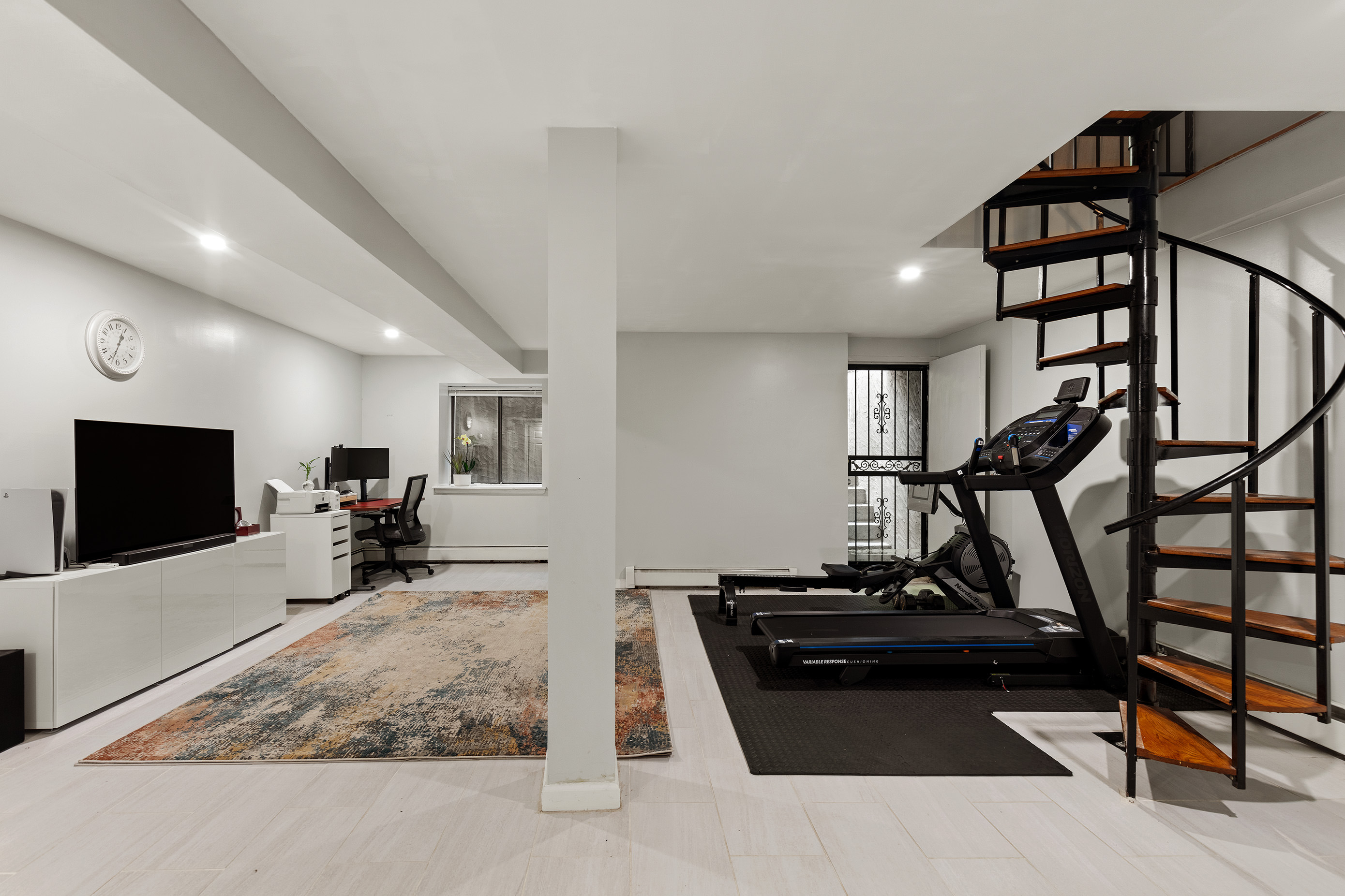 105-09 Otis Avenue, Unit 1B Queens, NY 11368 - Photo 2 of 9 a living room with lots of furniture and a flat screen tv