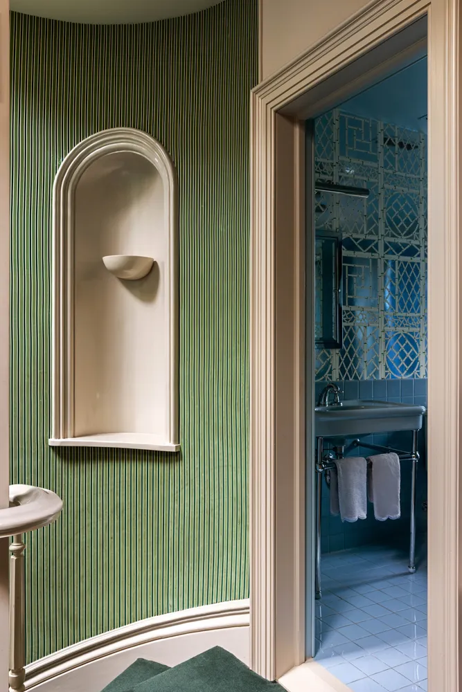 a bathroom with a toilet bathtub and window