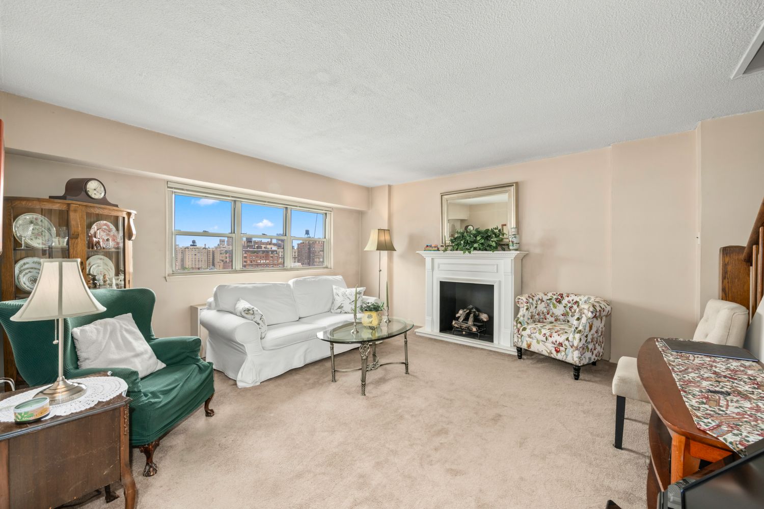 a living room with furniture and a fireplace