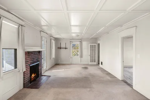 a view of a livingroom with a dishwasher and a refrigerator