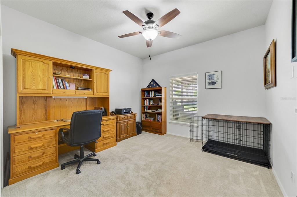 352 Giovani Boulevard Clermont, FL 34715 - Photo 15 of 46 a livingroom with workspace