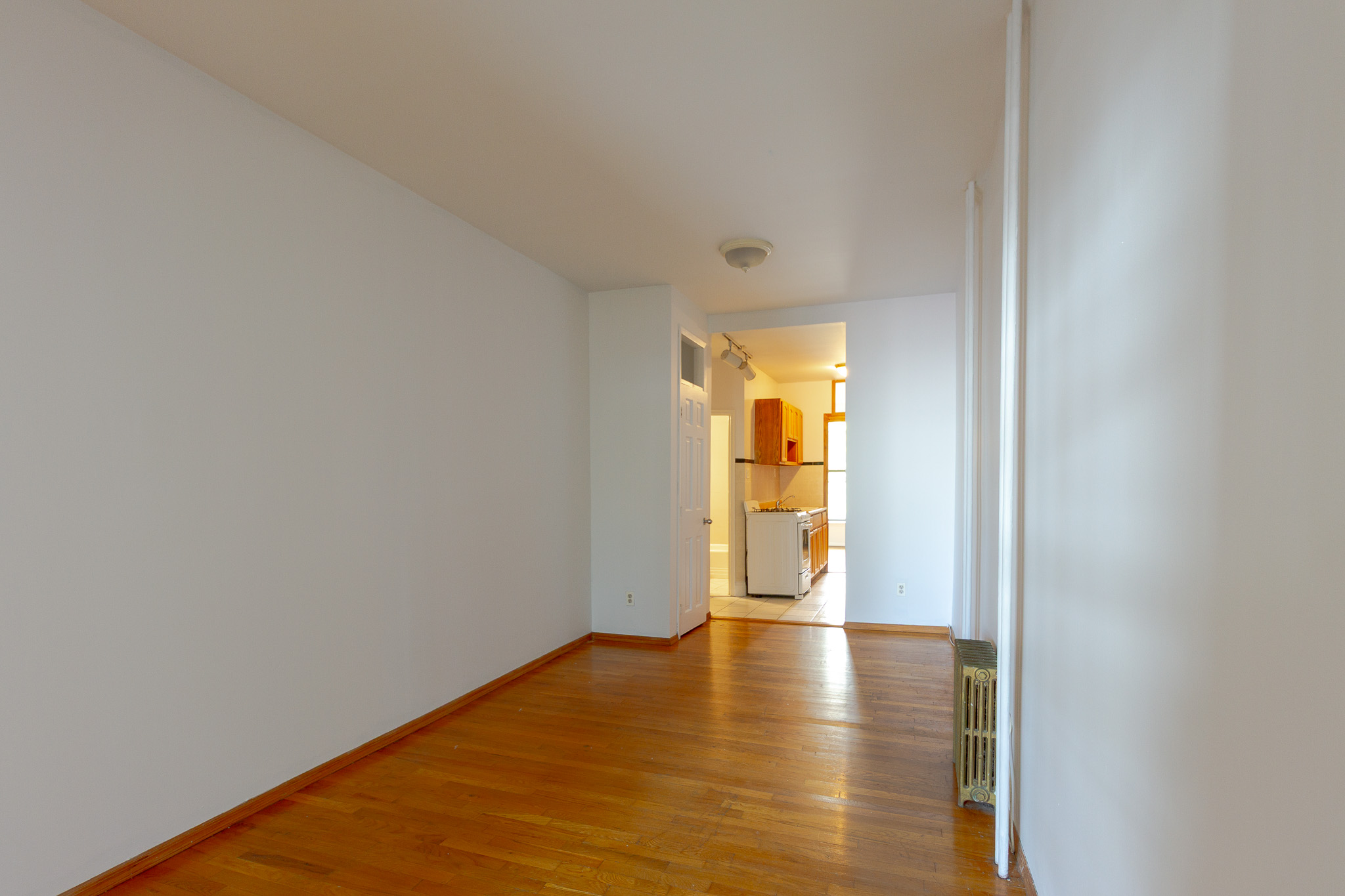 312 Prospect Avenue, Unit 2R Brooklyn, NY 11215 - Photo 4 of 10 a view of empty room with wooden floor