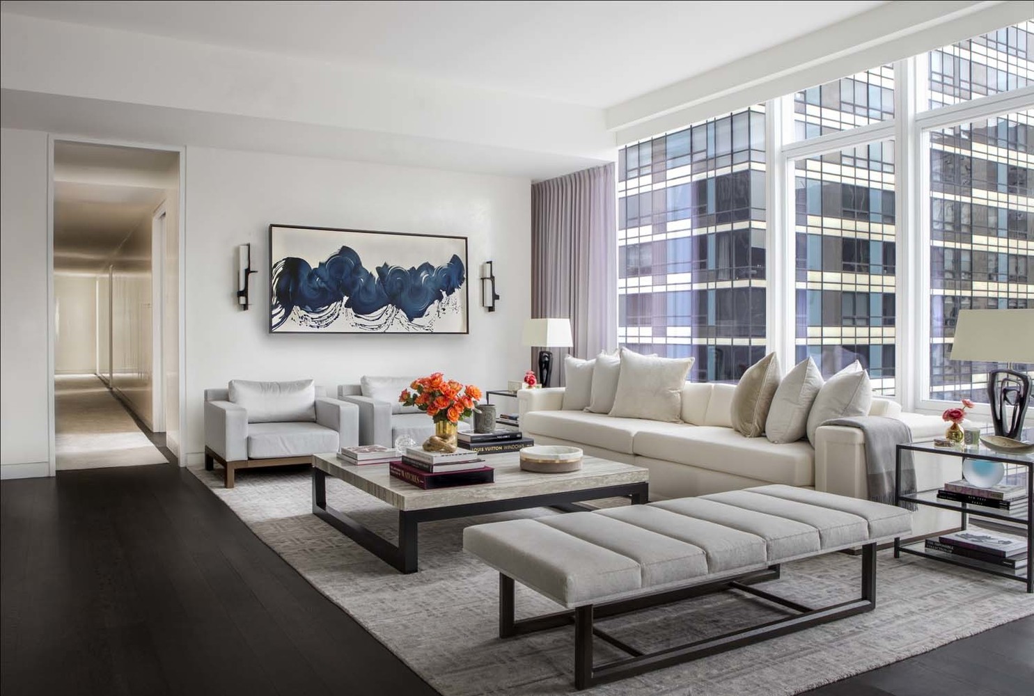 20 West 53rd Street, Unit 42A Manhattan, NY 10019 - Photo 12 of 31 a living room with furniture a rug and a large window
