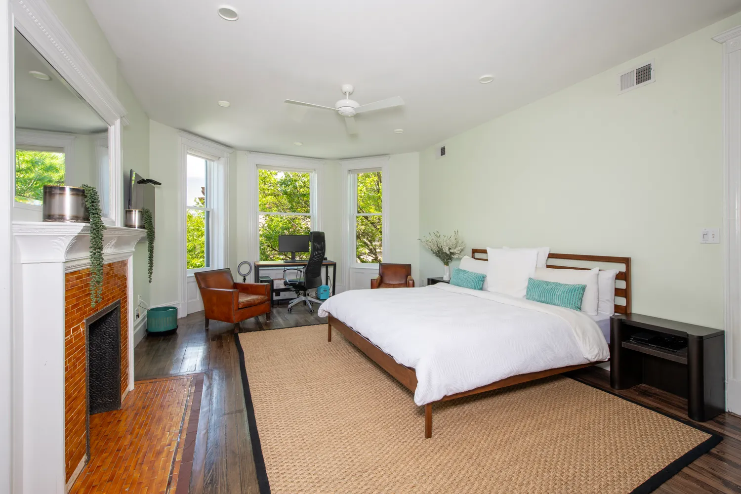 a room with two beds and a window