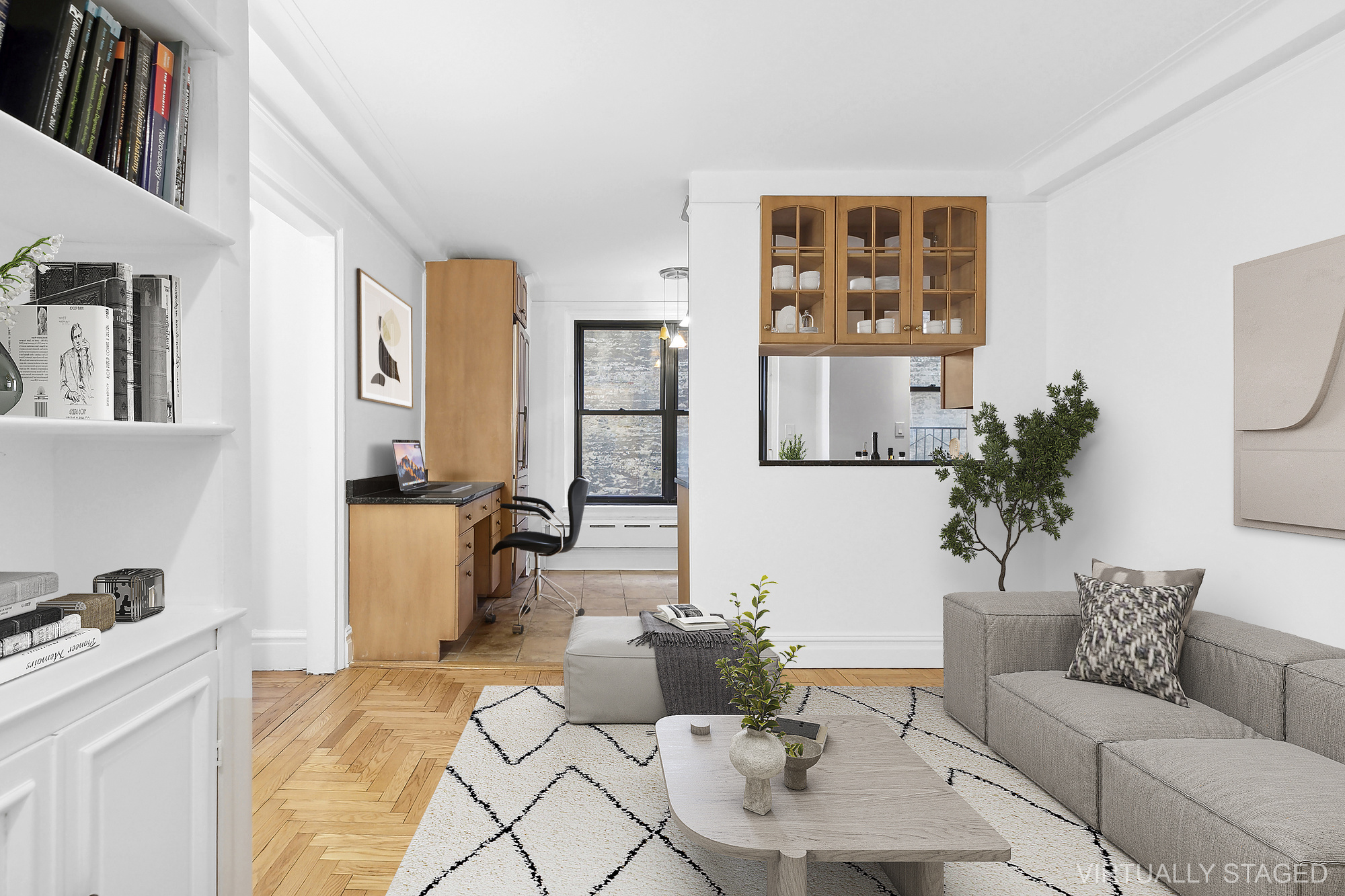 a living room with furniture and a potted plant