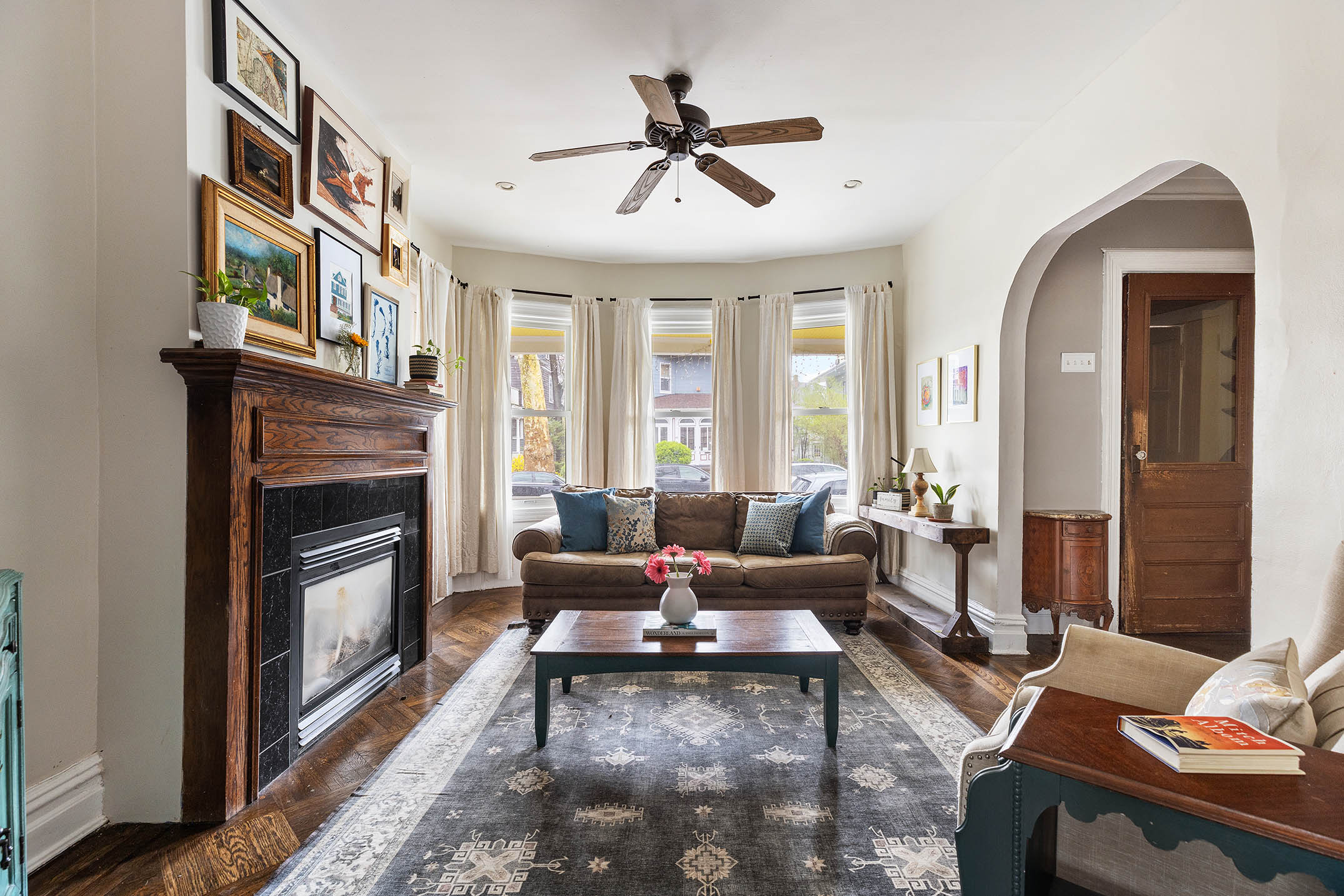 267 Marlborough Road Brooklyn, NY 11226 - Photo 2 of 14 a living room with furniture a fireplace and a chandelier