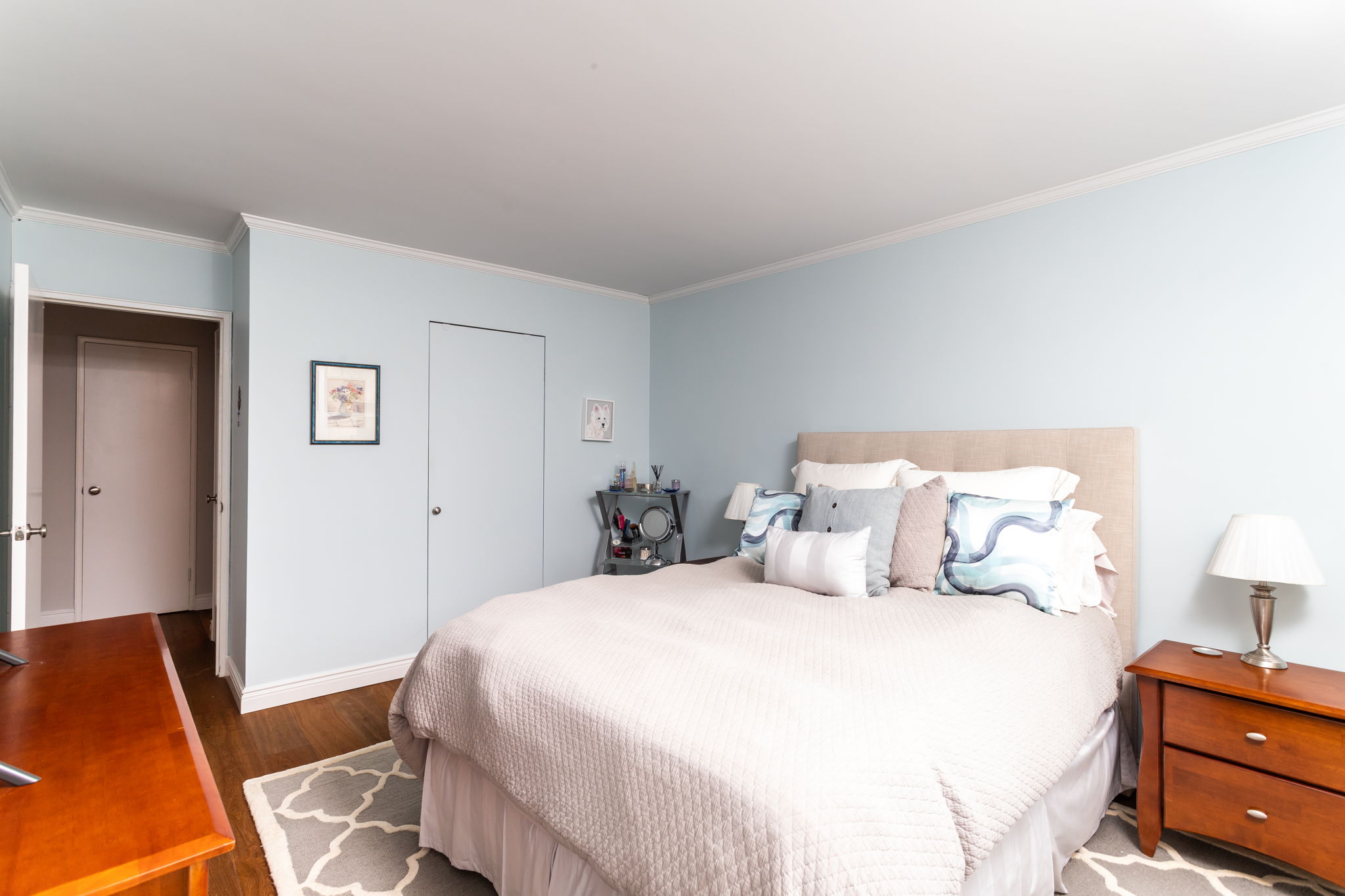 415 East 85th Street, Unit 5J Manhattan, NY 10028 - Photo 11 of 19 a bedroom with a bed and wooden floor