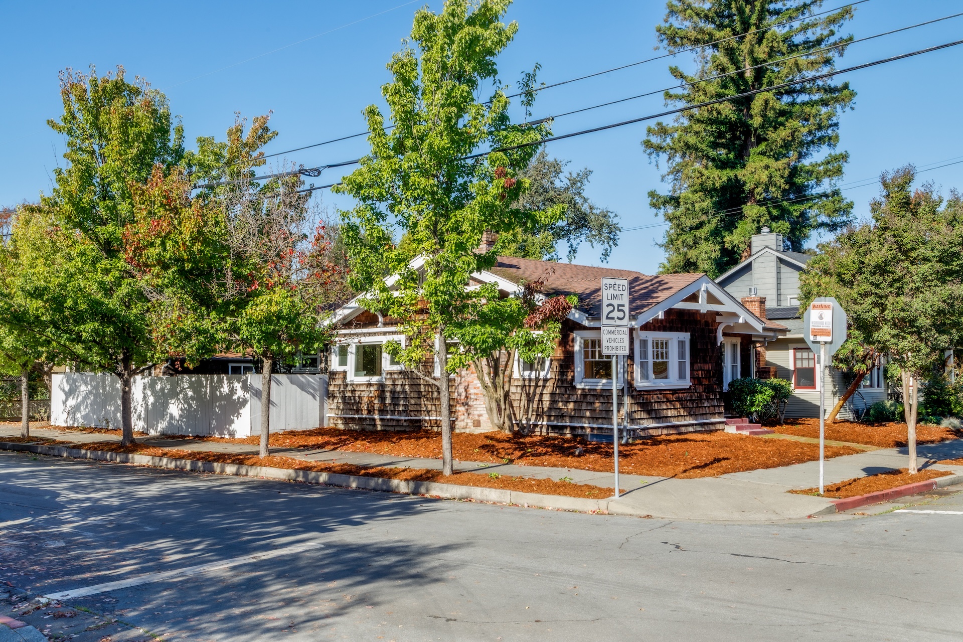 1203 Glenn Street Santa Rosa, CA 95401 - Photo 5 of 26 a view of a building with palm trees and a small yard