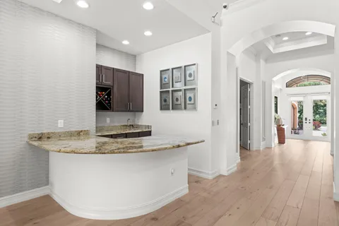 a view of living room filled with furniture and wooden floor