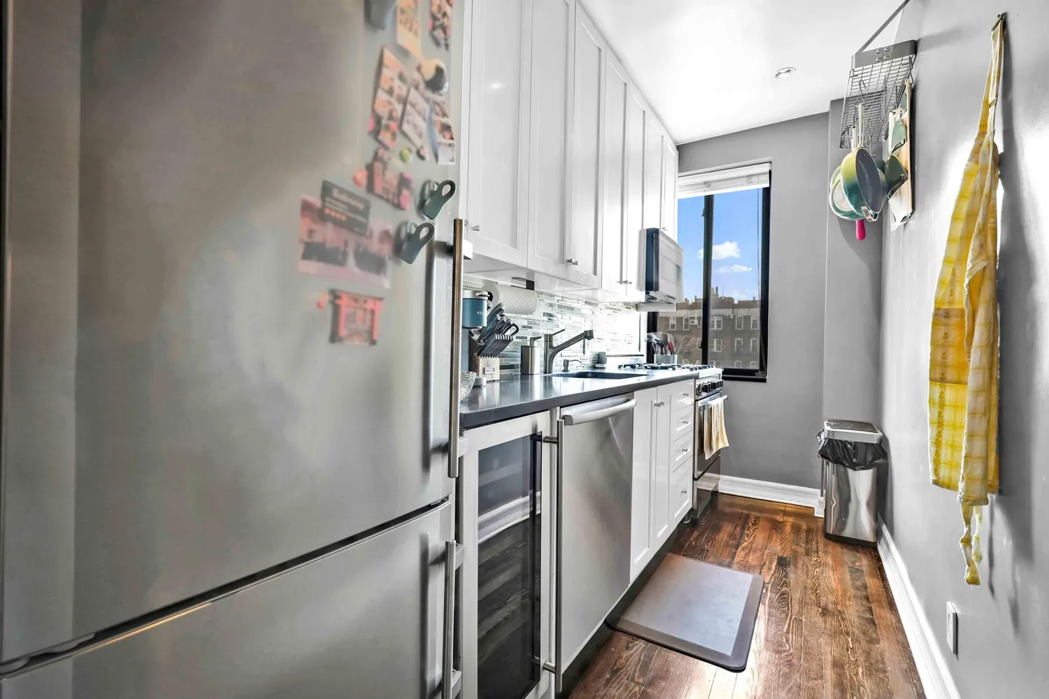 a kitchen with stainless steel appliances a refrigerator and a stove