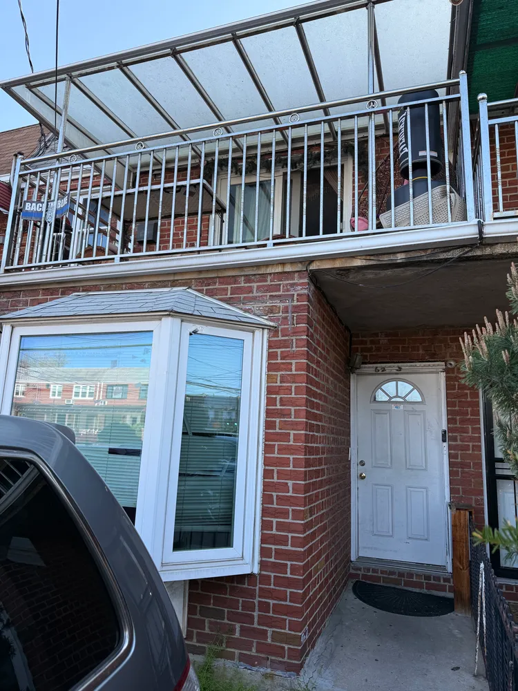 a view of a house with a door and balcony