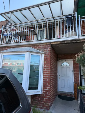 a view of a house with a door and balcony