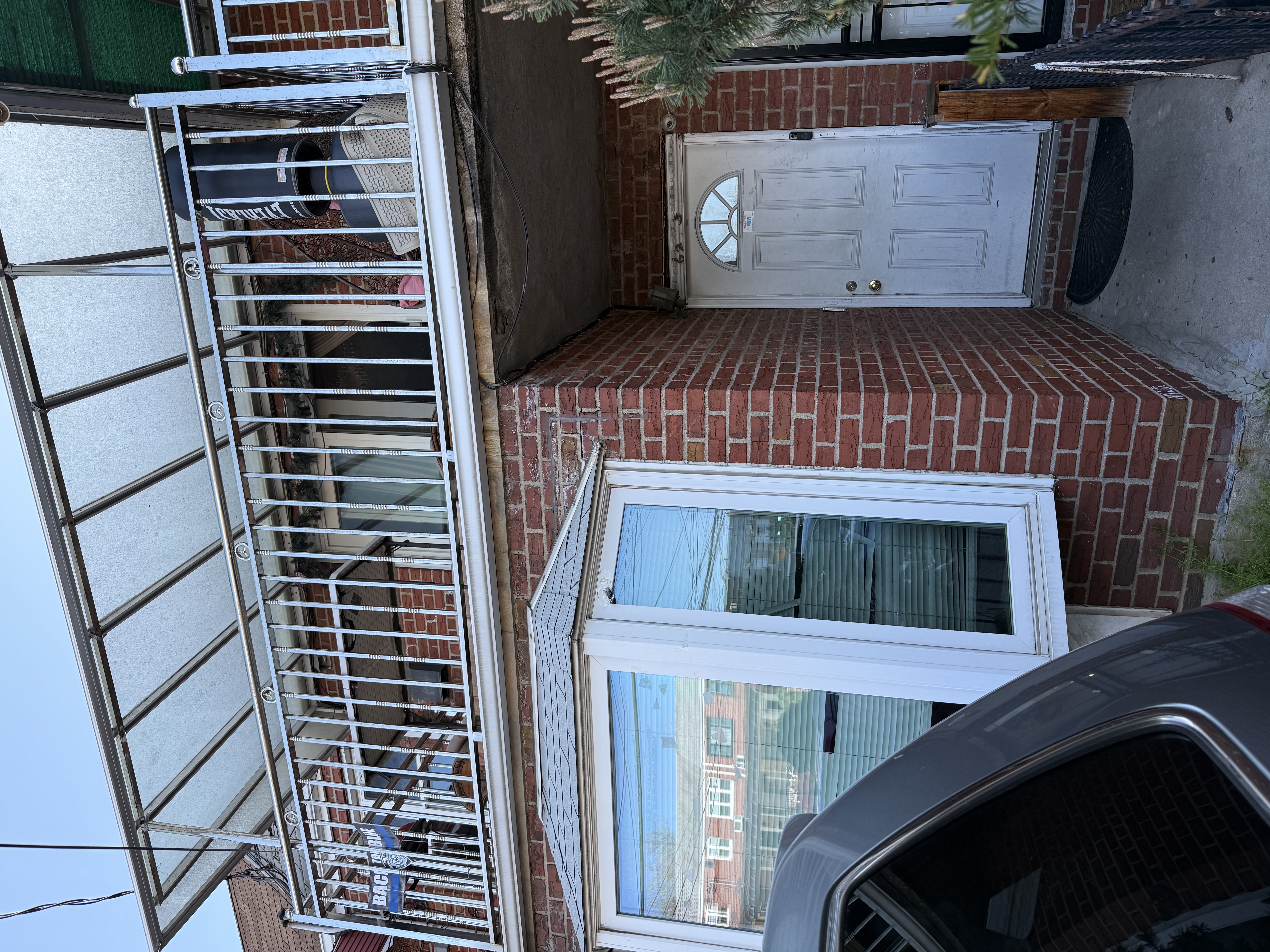 62-23 69th Place Queens, NY 11379 - Photo 1 of 4 a view of a house with a door and balcony