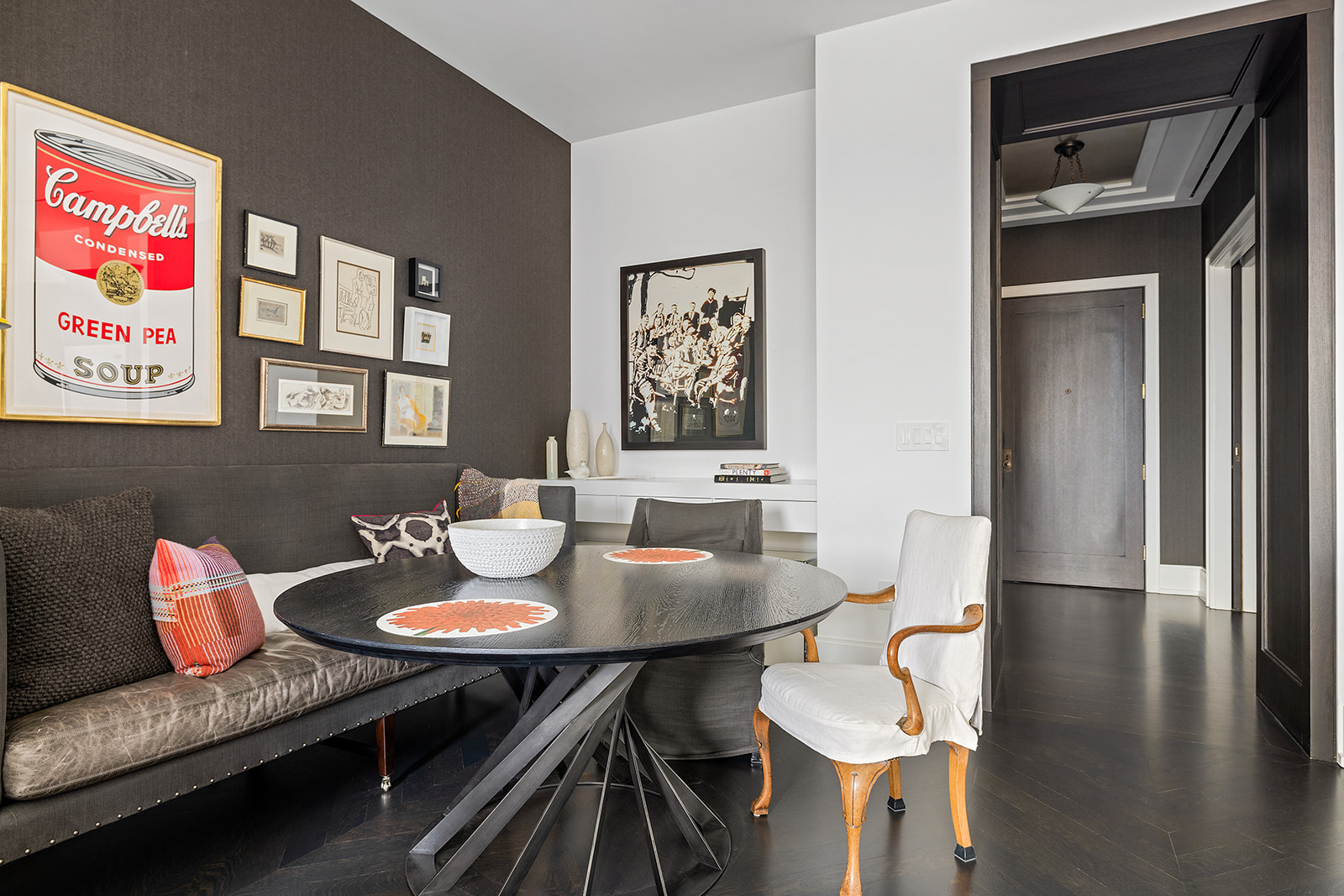 212 West 18th Street, Unit 9C Manhattan, NY 10011 - Photo 5 of 10 a view of a dining room with furniture and wooden floor