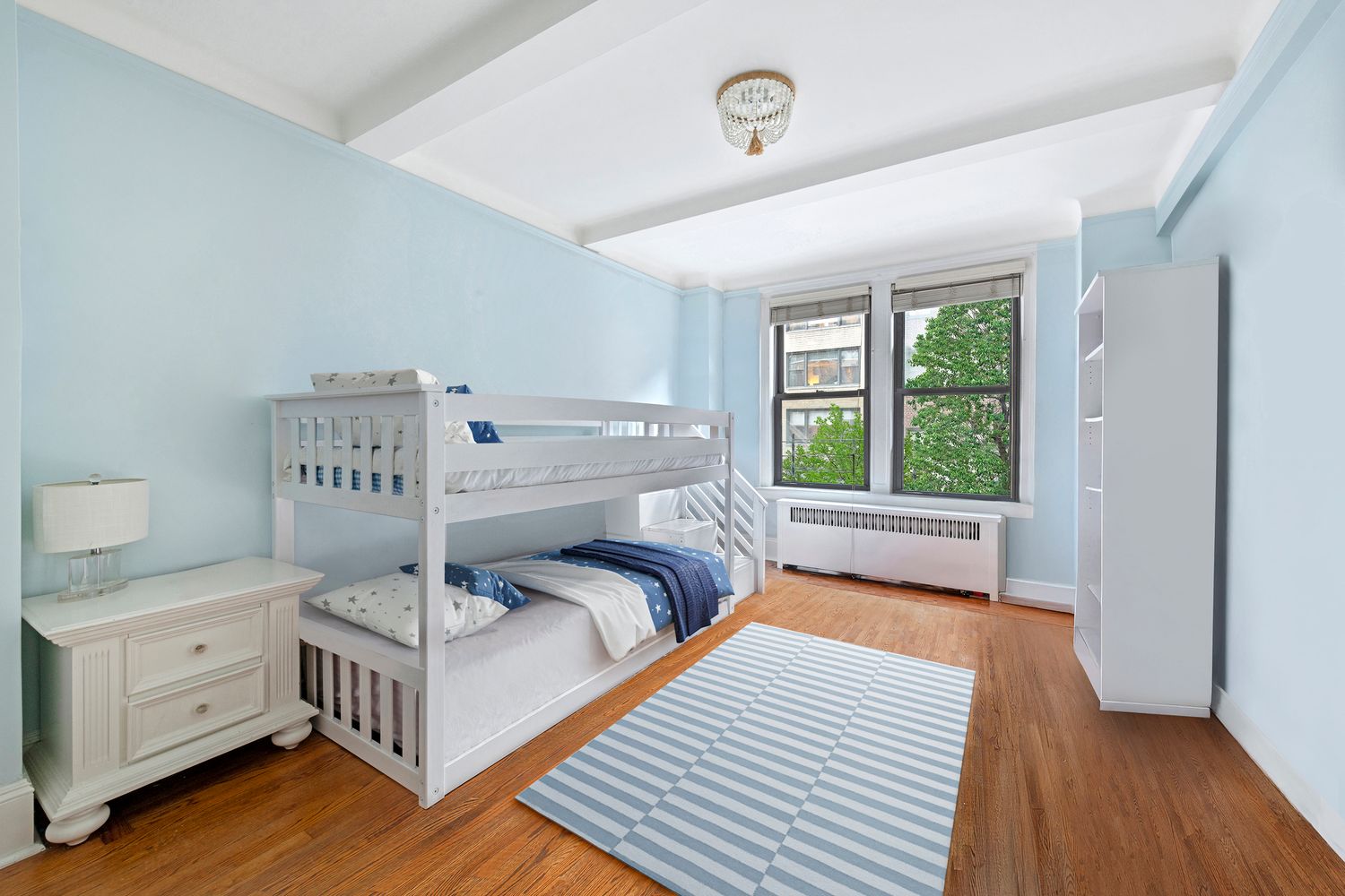 333 East 53rd Street, Unit 3KL Manhattan, NY 10022 - Photo 7 of 10 a view of a bedroom with furniture and windows