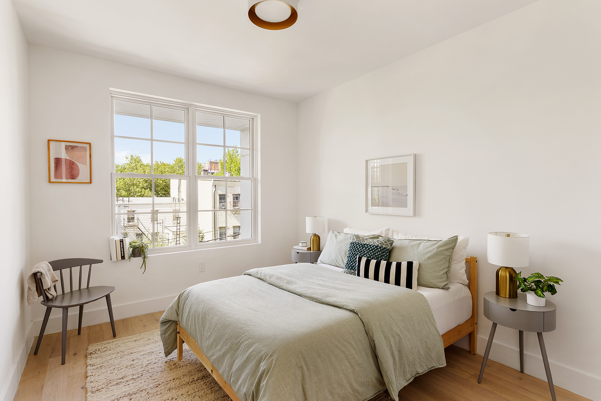 185 Ainslie Street, Unit 3 Brooklyn, NY 11211 - Photo 6 of 12 a spacious bedroom with a bed and wooden floor