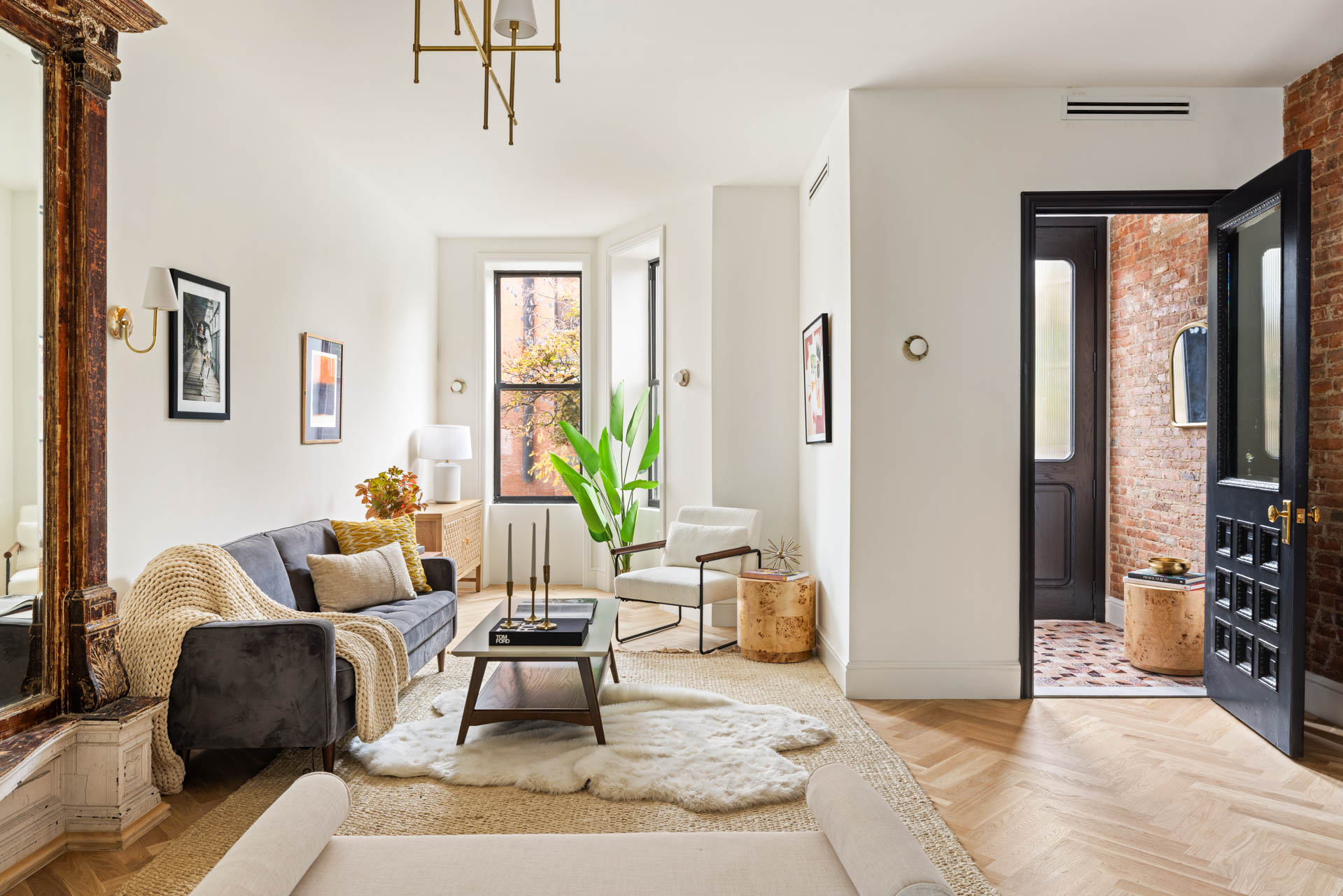 a living room with furniture and a window