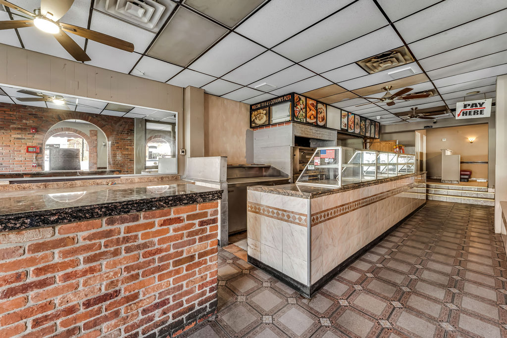 601-603 Washington Street, Unit RESTAURANT Hoboken, NJ 07030 - Photo 5 of 27 a view of a kitchen with stainless steel appliances granite countertop a sink and cabinets