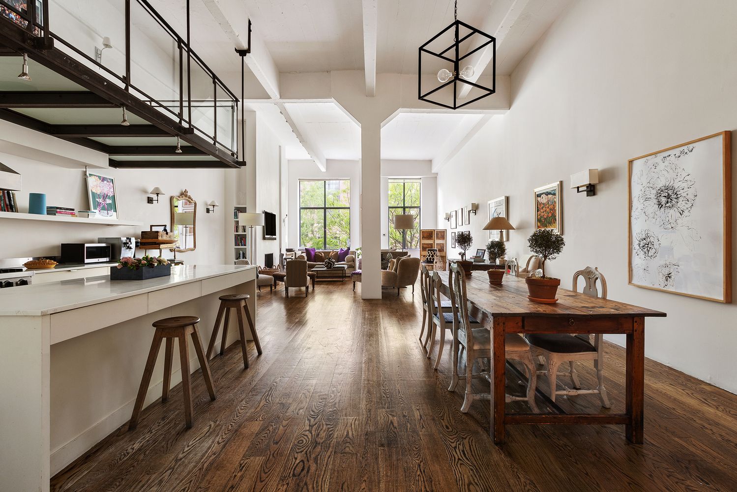 a view of a dining room with furniture kitchen and wooden floor