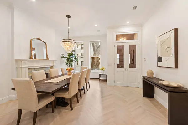 a dining room with furniture and window