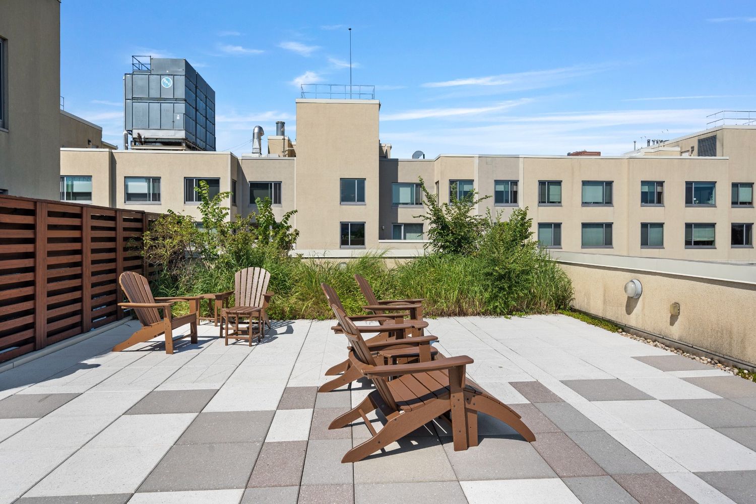 40 West 116th Street, Unit B503 Manhattan, NY 10026 - Photo 29 of 36 a view of a patio with a table and chairs and potted plants