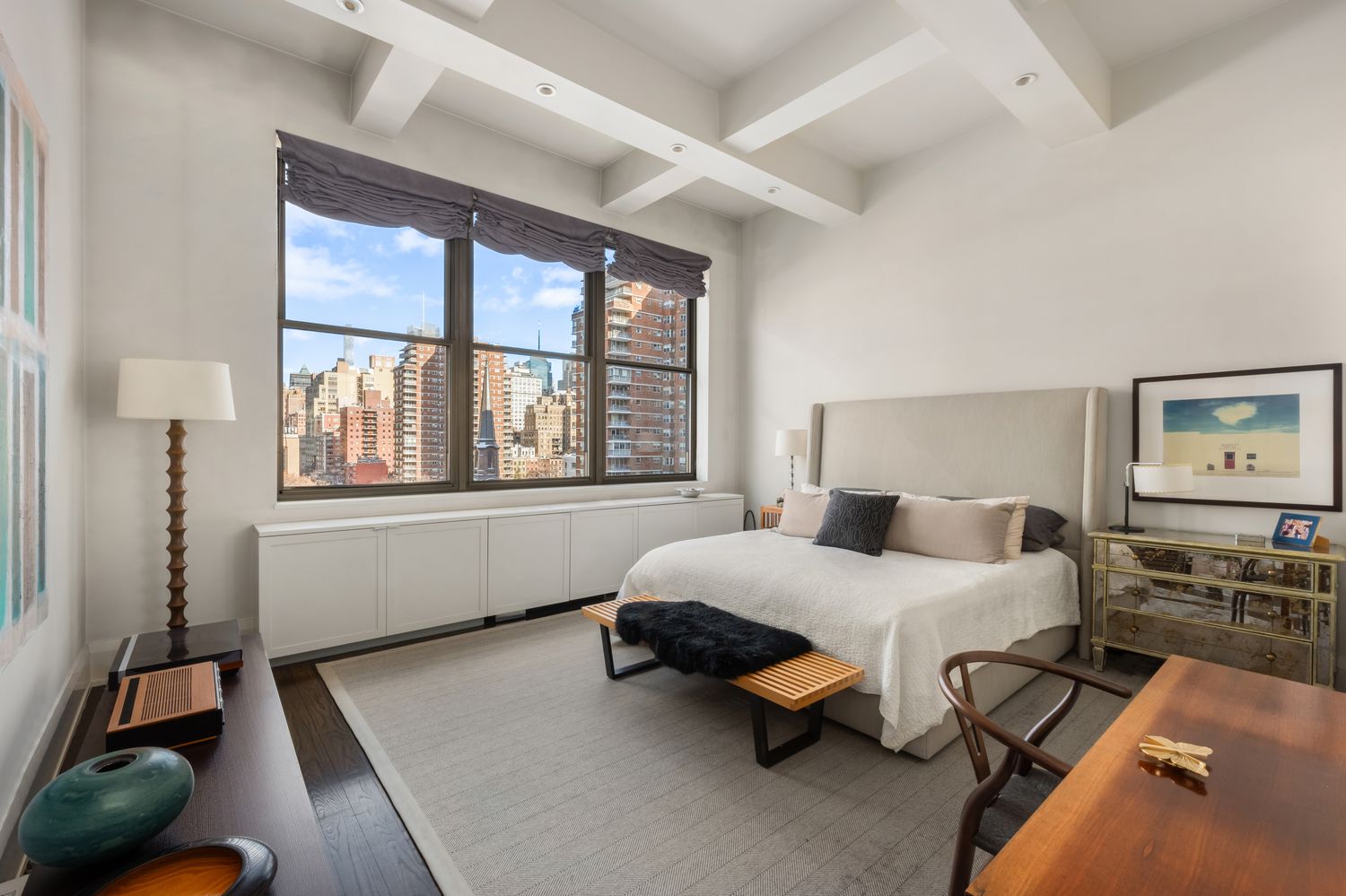 a bedroom with a bed and window