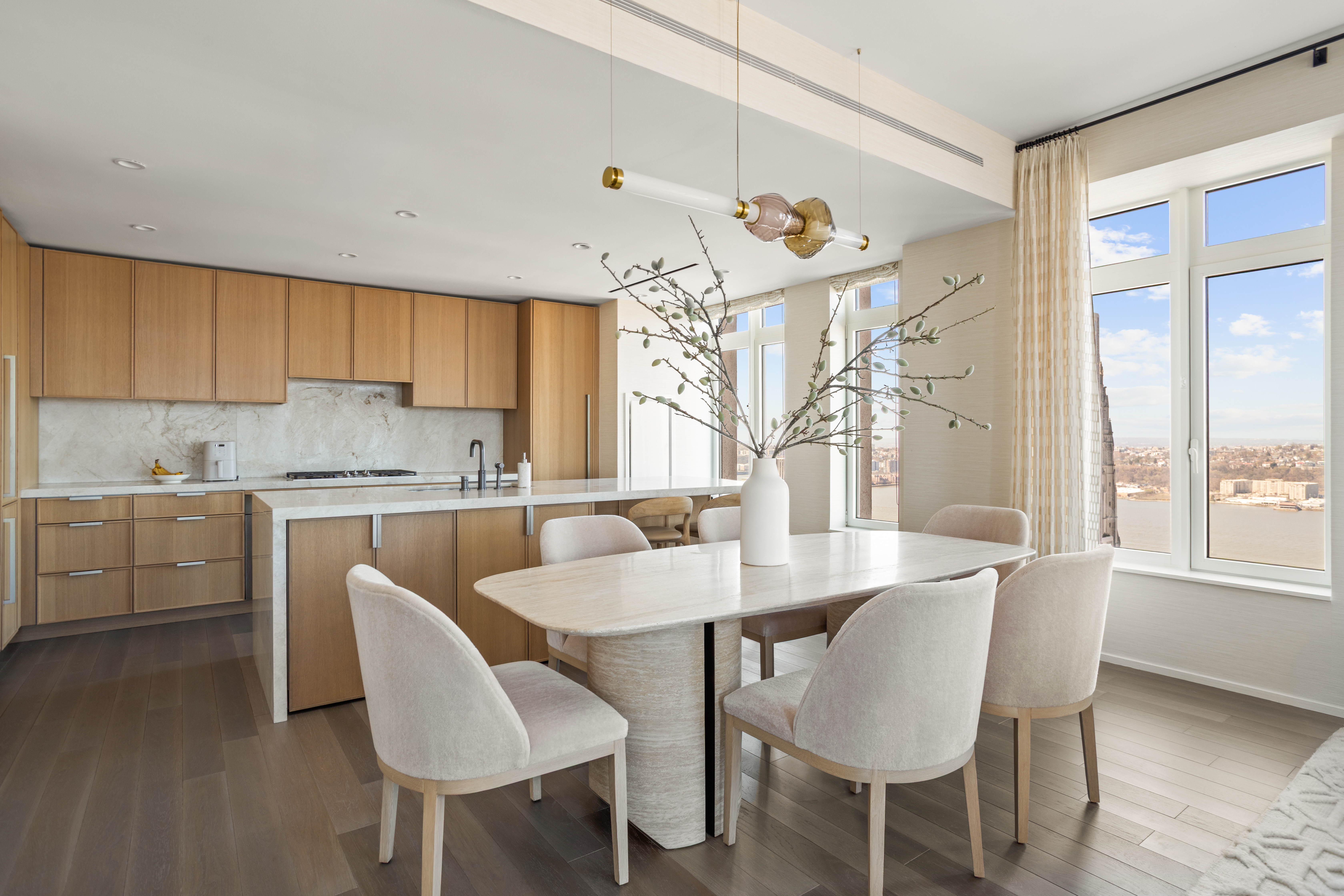543 West 122nd Street, Unit PH31A Manhattan, NY 10027 - Photo 13 of 40 a view of a dining room with furniture and a chandelier