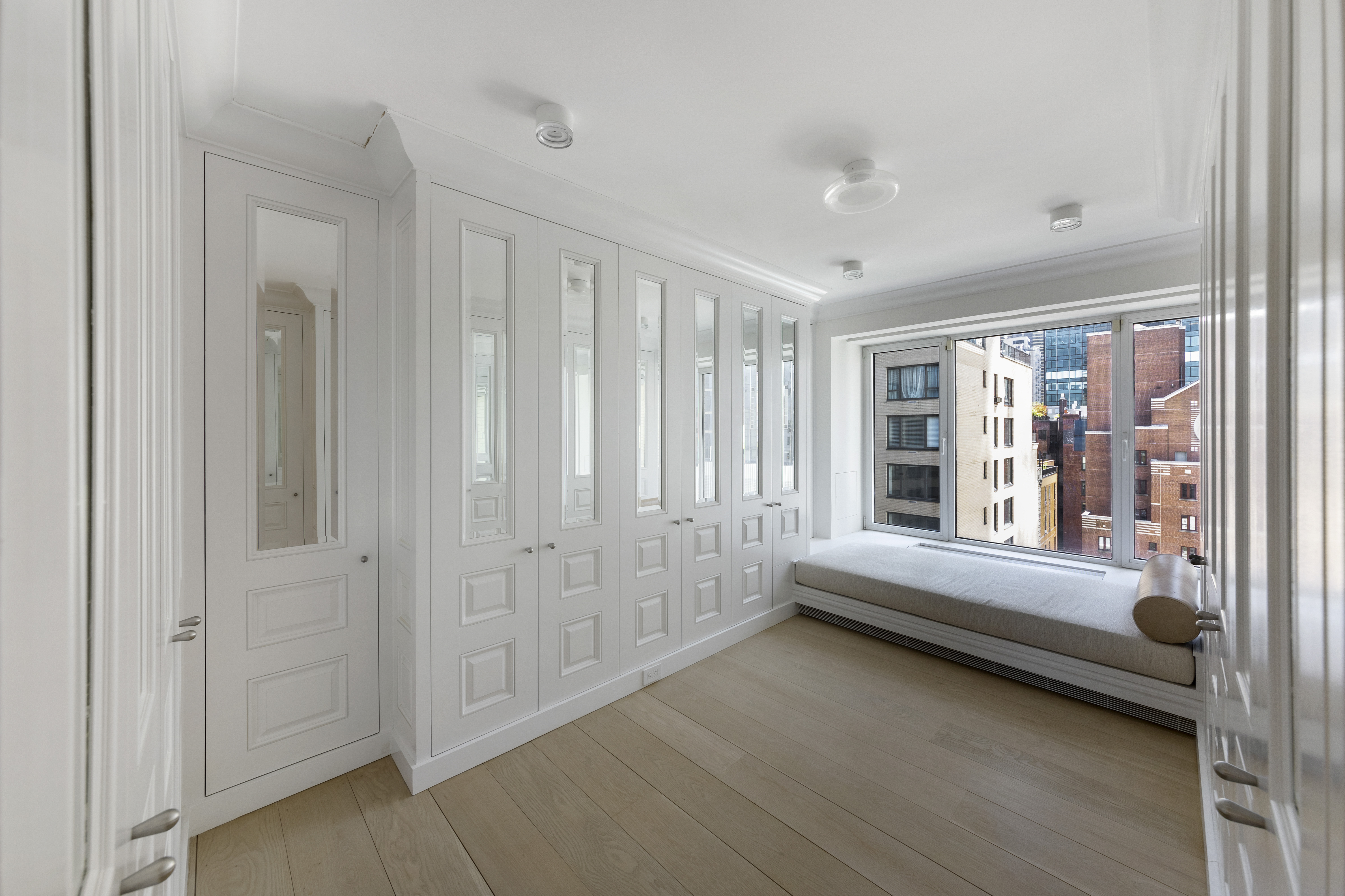 200 Central Park South, Unit 20DEF Manhattan, NY 10019 - Photo 10 of 16 a bedroom with furniture and a window