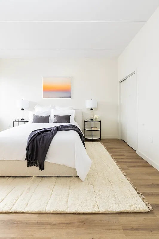 8 Palmetto Street, Unit 512 Brooklyn, NY 11221 - Photo 5 of 15 a bedroom with a bed and a couch