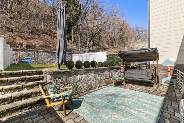 a view of yard with swimming pool and trees in the background