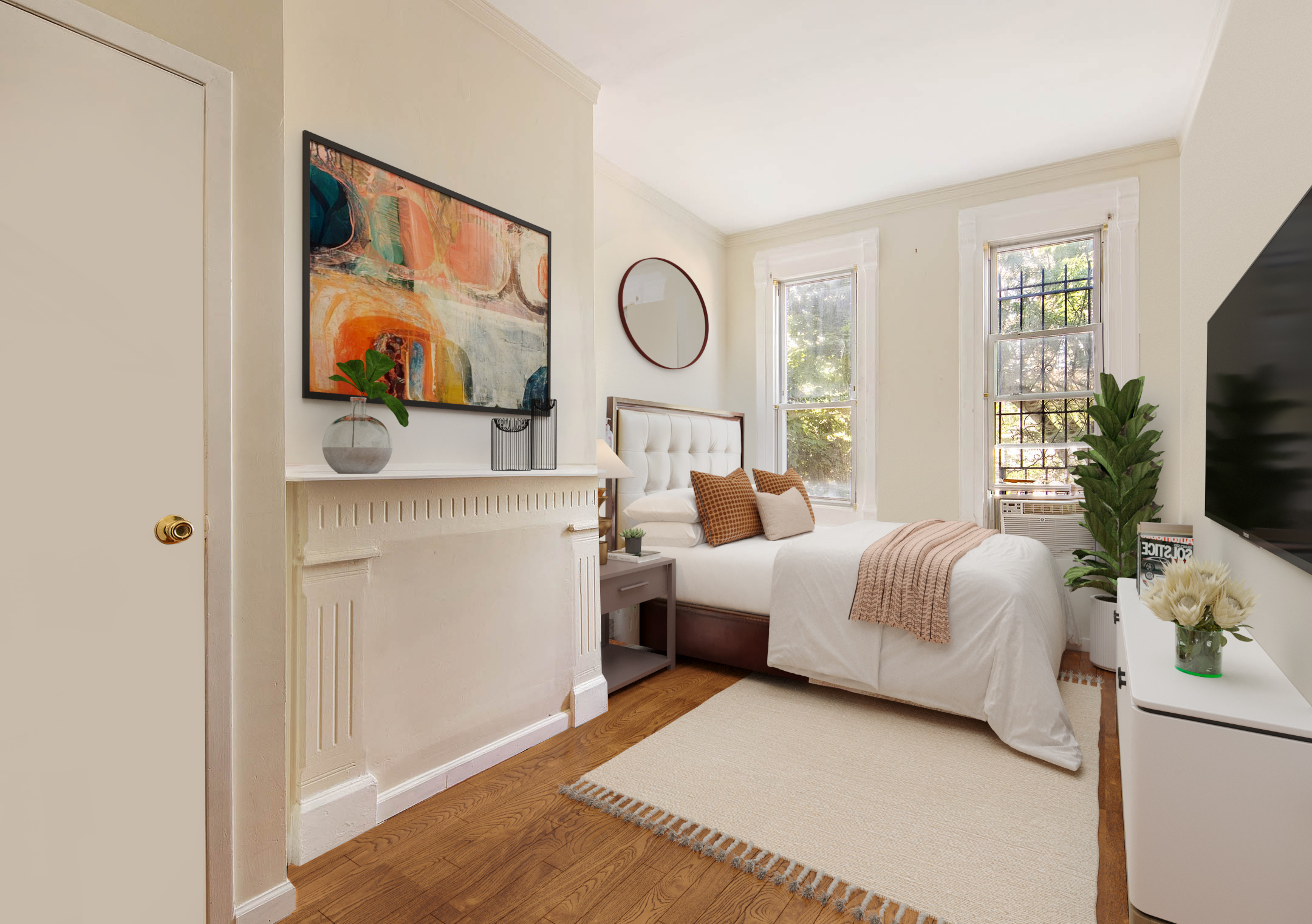 1008 Bushwick Avenue Brooklyn, NY 11221 - Photo 7 of 11 a bedroom with a bed and a flat screen tv