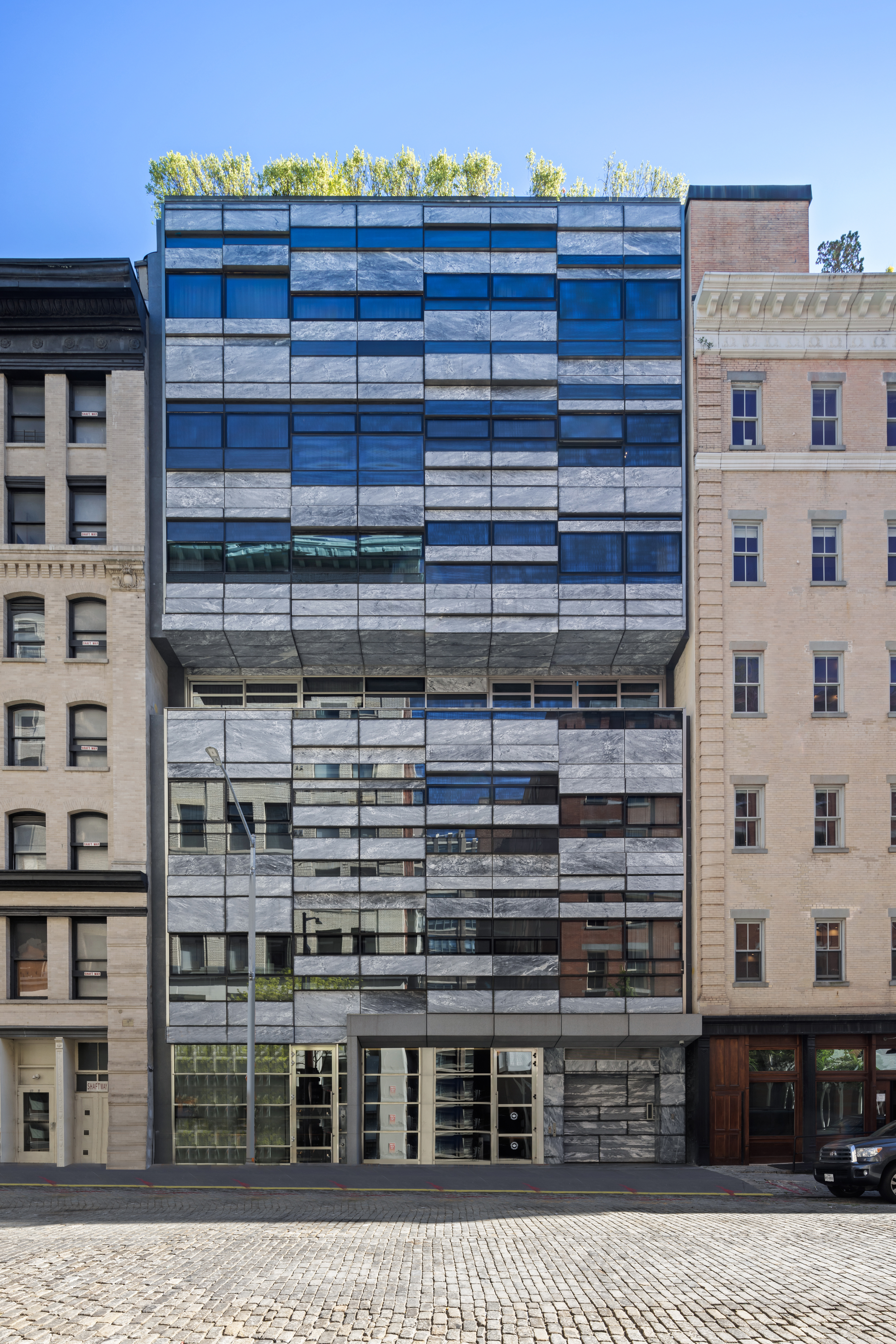 33 Vestry Street, Unit TH1 Manhattan, NY 10013 - Photo 16 of 17 a front view of a building with glass windows