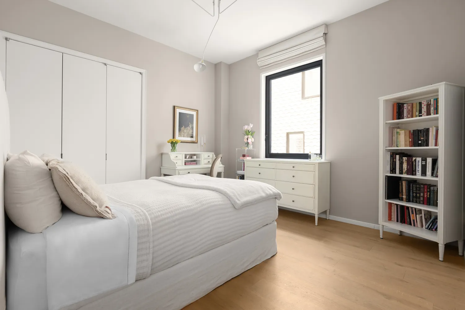 a bedroom with a bed and a window