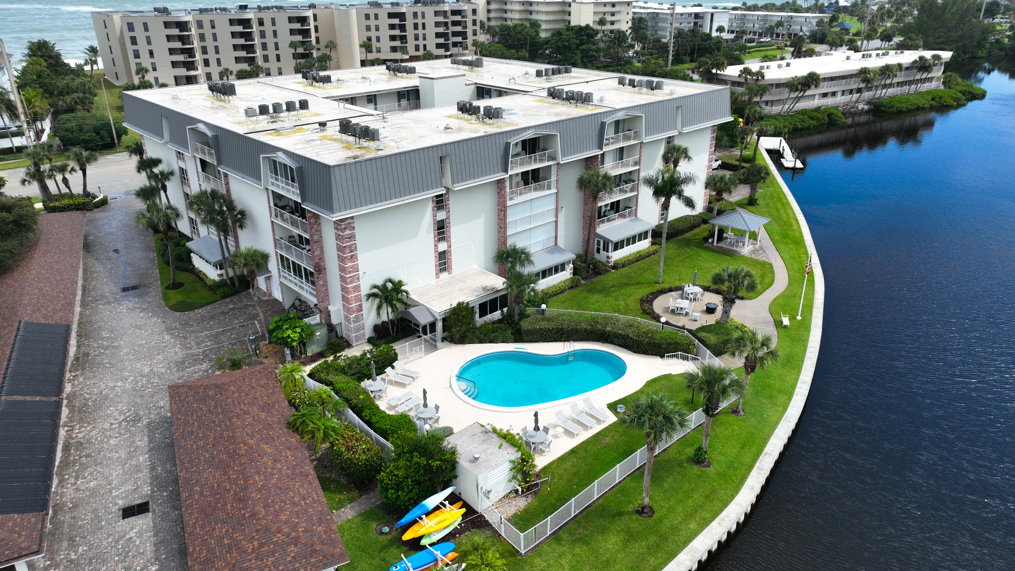 4601 Highway A1a, Unit 102 Vero Beach, FL 32963 - Photo 25 of 29 a picture of a table and chairs in the patio