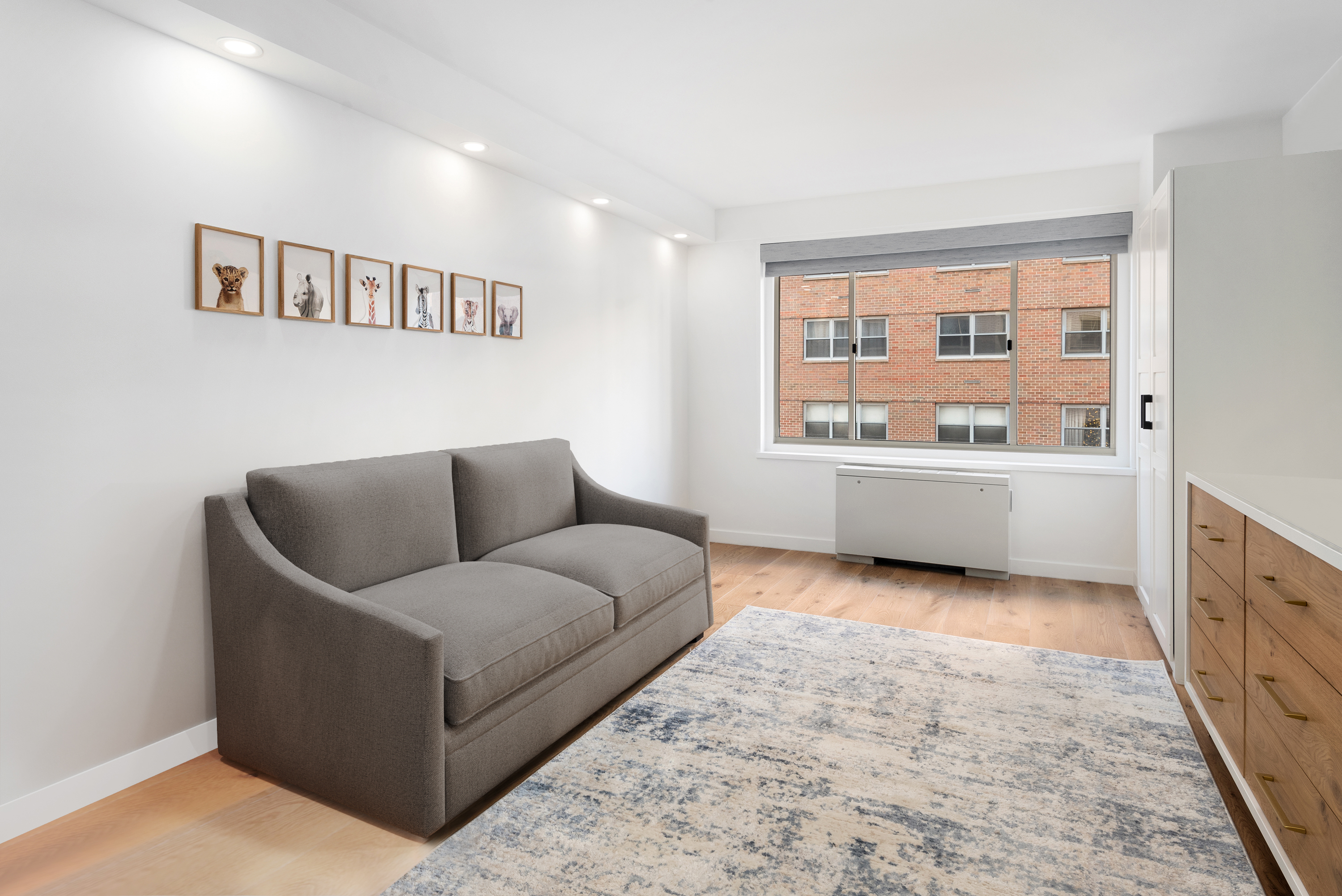 30 East 65th Street, Unit 6B Manhattan, NY 10065 - Photo 8 of 14 a living room with furniture and window