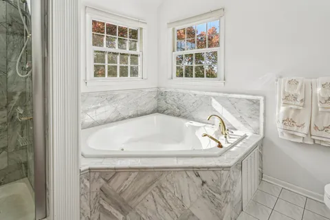 a bath tub sitting next to a window
