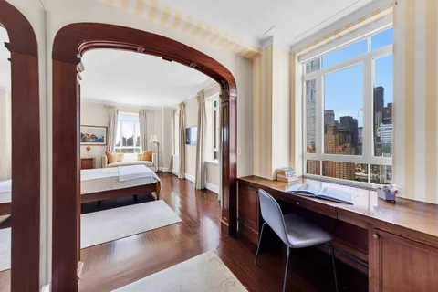 a living room with a large bed and furniture